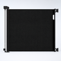 Black retractable mesh pet gate fully extended on a cool white background View 11