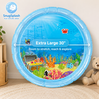 Extra large 30 inch water mat with a printed reef scene, shown on a nursery floor View 2