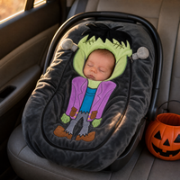 Sleeping baby wearing Frankenstein car seat cover View 5
