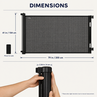 Retractable safety gate dimensions: 41 in / 104 cm tall, extends to 79 in / 200 cm wide, with phone for scale View 7