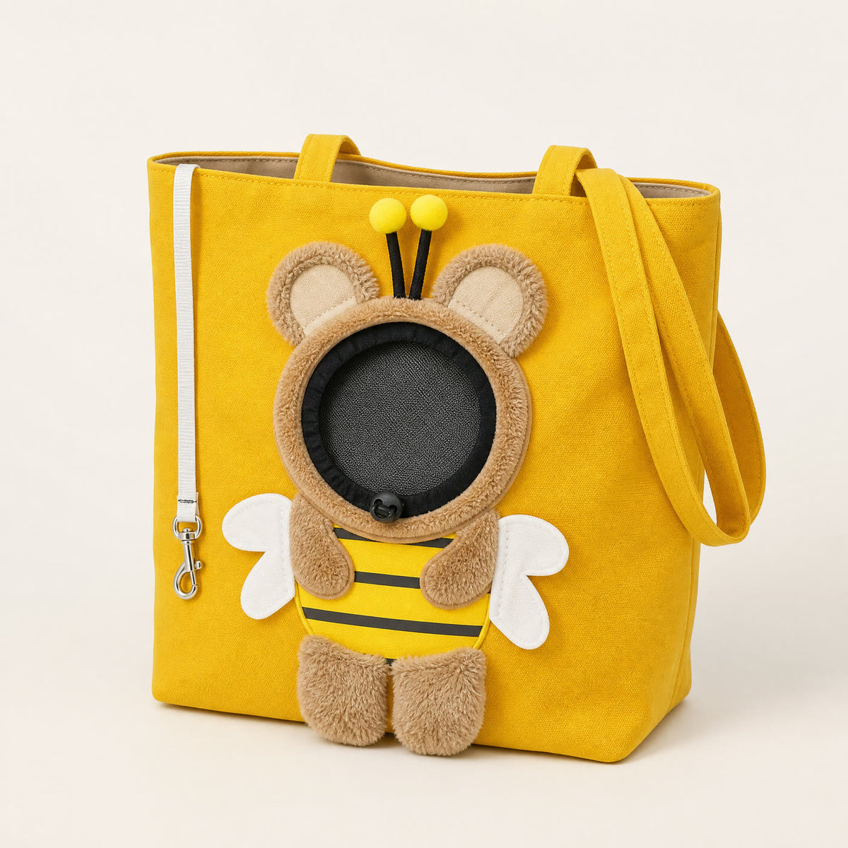 Baby Bubble Bumble Buddy pet carrier tote in bumblebee yellow canvas, studio front angle View 1