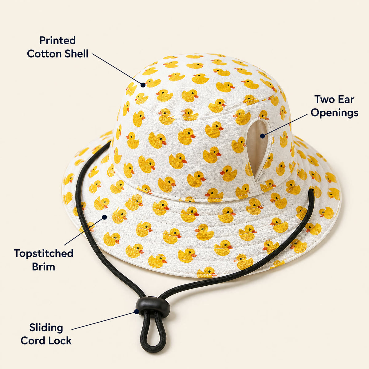 Feature callouts: printed cotton shell, two ear openings, topstitched brim, sliding cord lock View 2